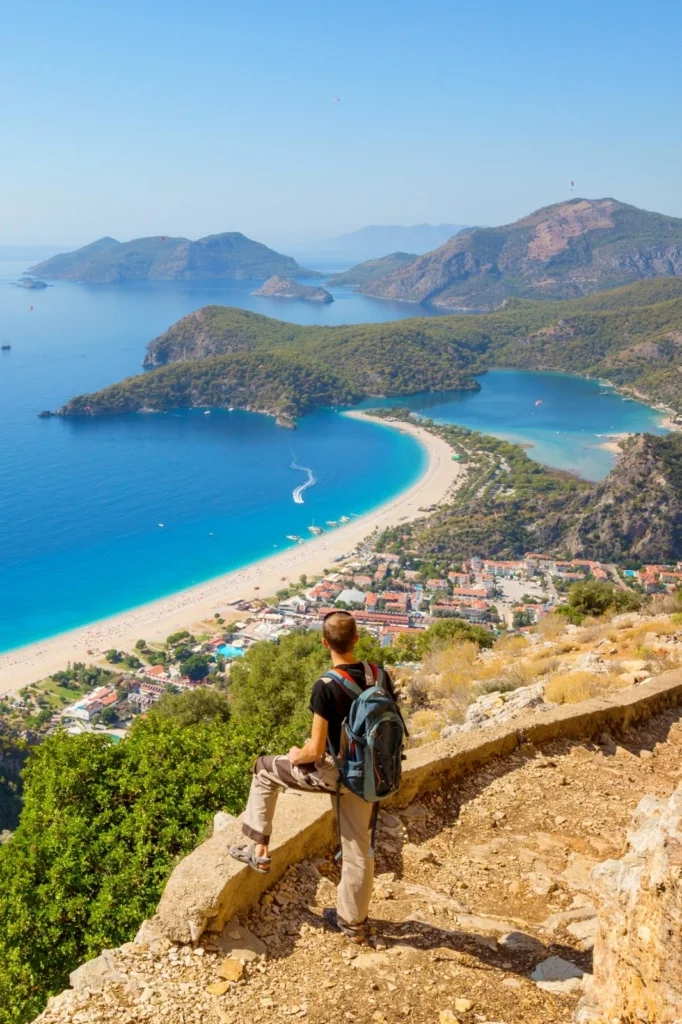 Hiker overlooking scenic coastline on the Lycian Way, Turkey.
