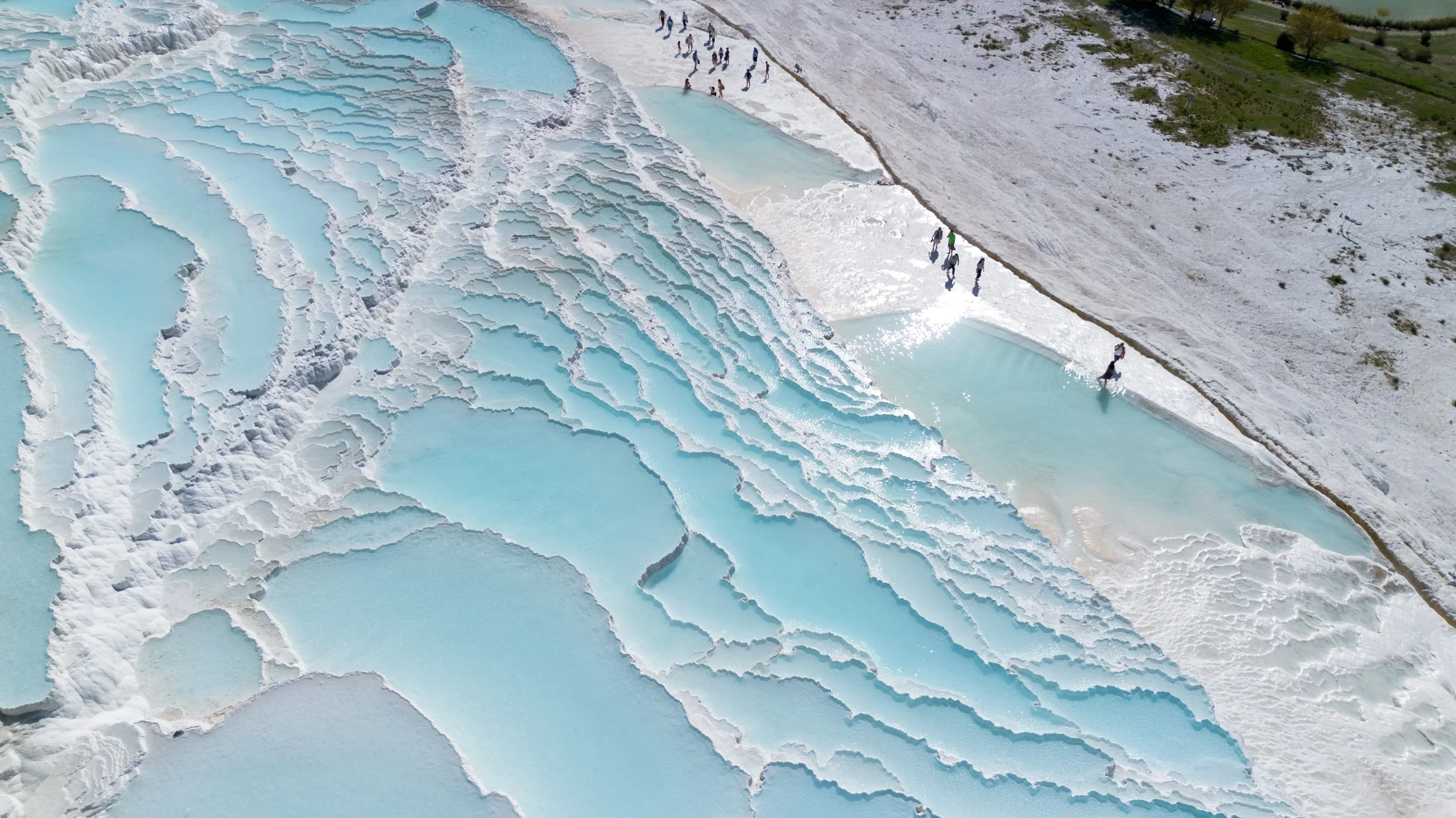 Aerial view of Pamukkale's turquoise travertine pools.