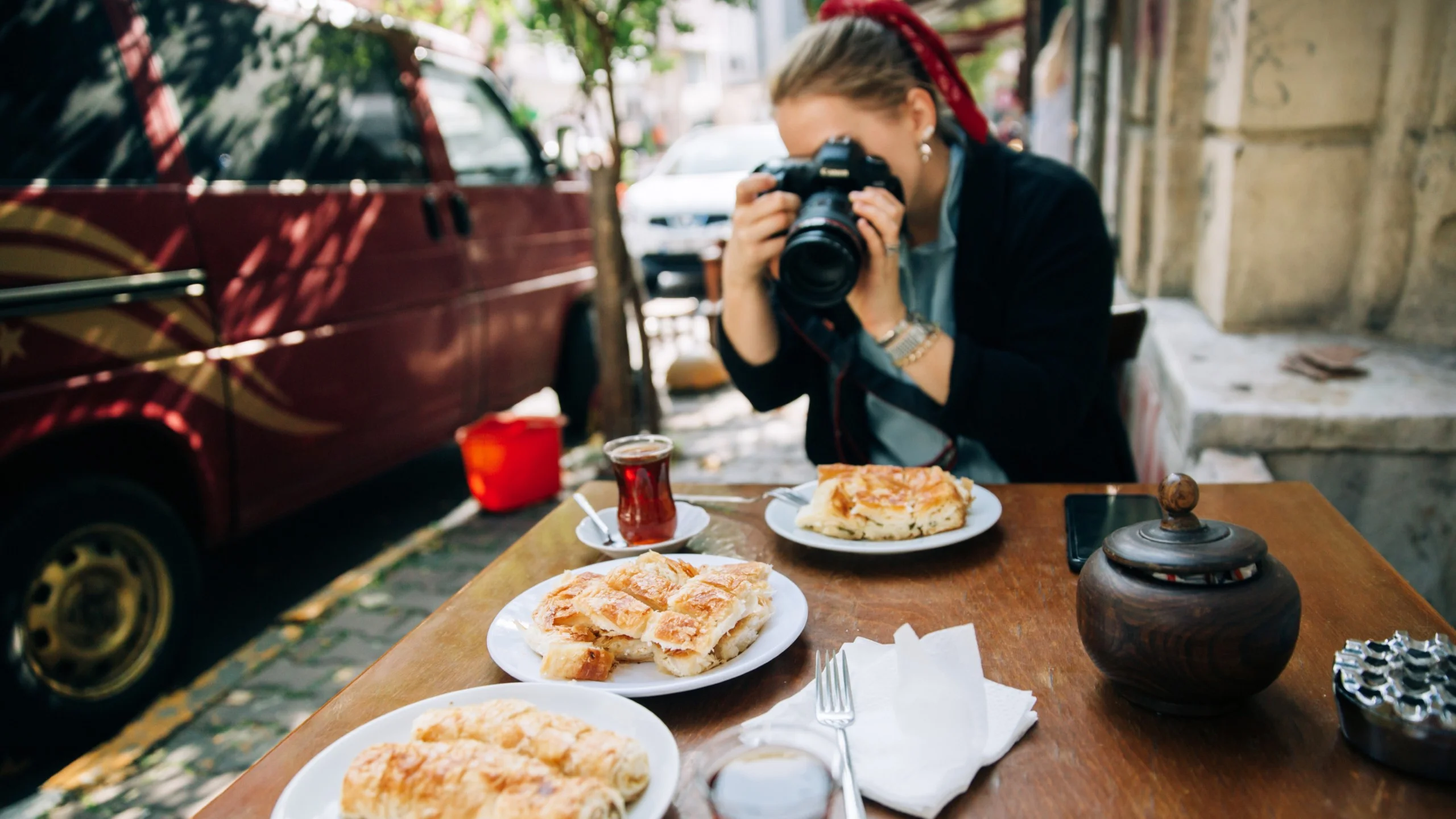 Tourist photographing Turkish breakfast in Istanbul
